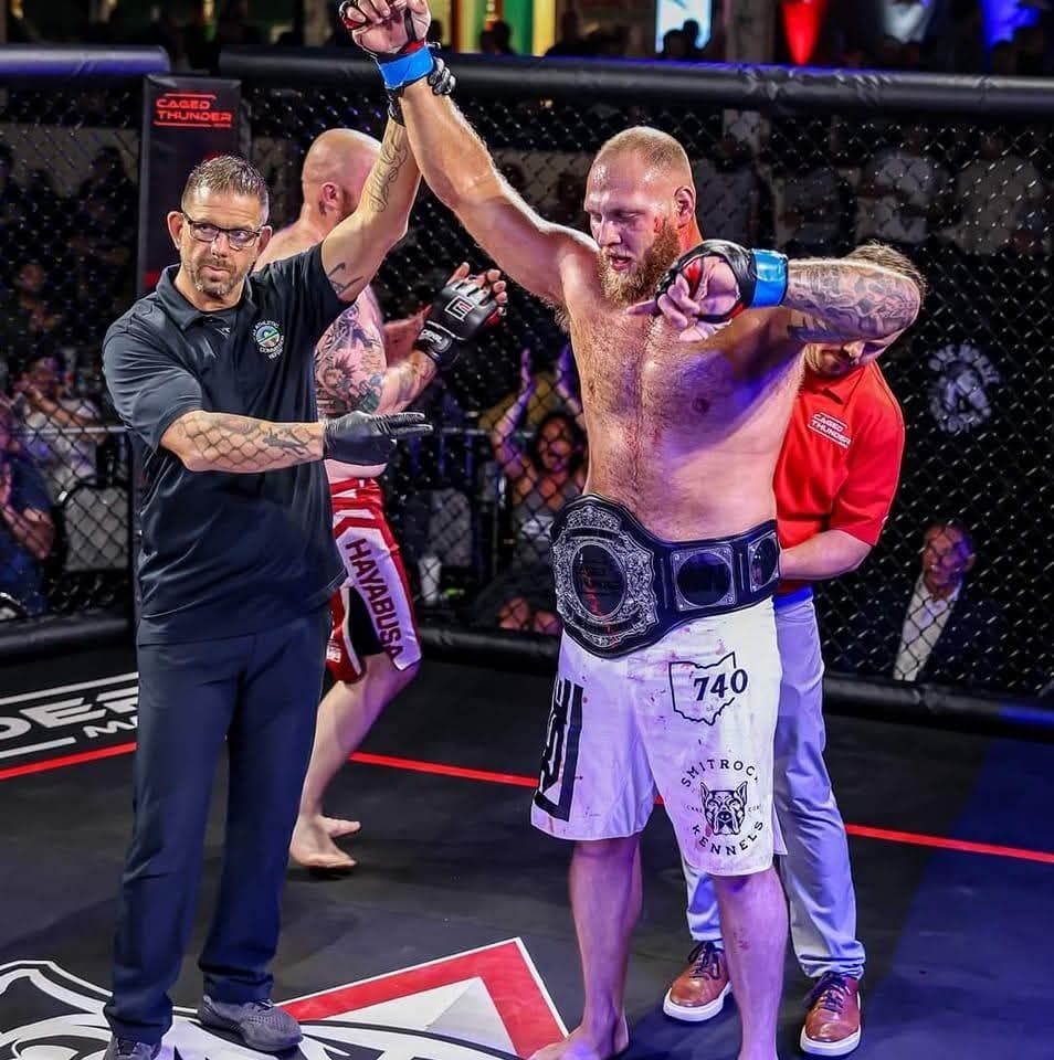 RJ 'The Hammer' Harris, a professional champion fighter from Zanesville, Ohio, is seen receiving his championship beltâcelebrating his success in combat sports. As part of his training and recovery regimen, RJ works with Truly Heal Wellness to maintain peak performance through advanced massage therapy, manual bodywork, and stretch therapy. Recently signed to a 3-fight contract with a top-tier combat sports organization, RJ relies on Truly Heal Wellness for post-fight recovery, injury prevention, and long-term athletic maintenance. This partnership underscores our commitment to supporting elite fighters across Northeast Ohi